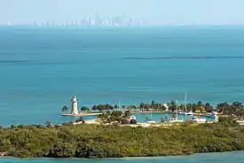 Aerial view of Boca Chita Key with the skyline of Miami in the distance