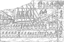 Transporte de toros androcefalos alados hacia el palacio de Nínive, copia de un bajorrelieve del palacio suroccidental de la misma ciudad, reinado de Senaquerib.