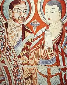 Fresco chino del siglo IX representando a monjes budistas; el de la izquierda con rasgos tocarios. Grutas Bezeklik o Grutas de los Mil Budas, ubicadas en Qian Fo Dong, cuenca del Tarim, Sinkiang, en la región autónoma de los uigures (China).