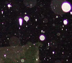 Esferas de la lluvia con coma y aberración cromática