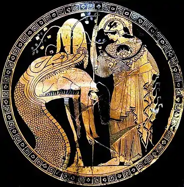 Cílix pintado por Duris en el que aparece Jasón regurgitado por el dragón que custodiaba el vellocino de oro, con Atenea a su lado. 480-470 a. C., Museos Vaticanos.