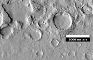 Terreno erosionado en Deuteronilus Mensae, foto tomada por HiRISE, por su programa HiWish