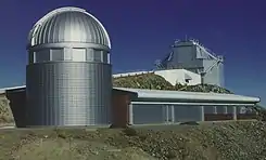 The enclosure of the Leonhard Euler Telescope with the higher situated New Technology Telescope (NTT) in the background