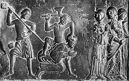 Representación medieval de los prusianos matando a San Adalberto, obispo misionero; parte de las Puertas de Gniezno, c. 1175.