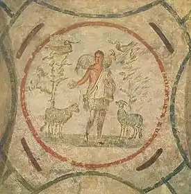 Cristo como Buen Pastor en las Catacumbas de Priscila (segunda mitad del siglo III), fresco paleocristiano.