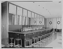 Stools around a bar in the building's Hemisphere Club