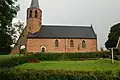 Iglesia de san Antonio en Kantens, iniciada en el siglo XIII, famosa por el sobresaliente contrafuerte de su torre.