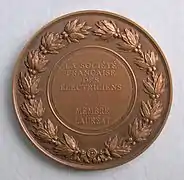 Medalla André-Marie Ampère de La société française des électriciens. Reverso.