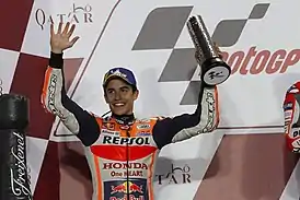 Marc Márquez 2018 Losail 2 Marc Márquez, celebrating on the podium after finishing in second place at the 2018 Qatar Grand Prix.