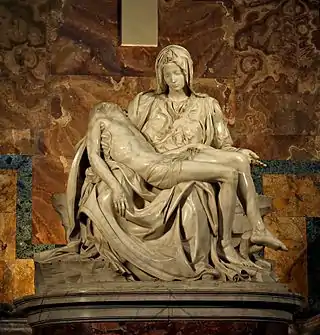 La Piedad por Miguel Ángel, María sosteniendo el cadáver de Jesús.