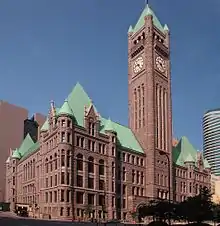 Four of city hall's turrets seen near the roof