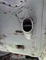 Toma de aire para enfriamiento y ventana de expulsión de casquillos en un SU-22.