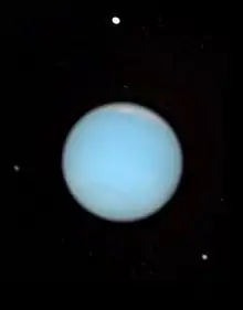 Neptuno, Proteo, Larisa y Despina en una imagen del telescopio Hubble.