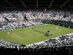 Disputa de un partido de tenis en Wimbledon.