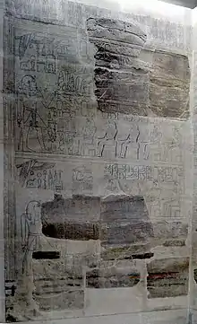 Fragments of reliefs interspersed with recent drawing showing the likely continuation of the damaged parts.