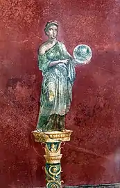 Fresco que representa a Urania, musa de la astronomía, con un globo terraqueo de la villa Moregine, Pompeya.