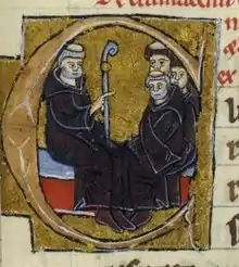 Pedro el Venerable instruye a sus monjes, en la miniatura de una letra capitular.