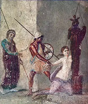 Fresco romano del atrio de la Casa del Menandro en Pompeya. Representa la escena del saqueo final de Troya por los aqueos; Casandra se agarra con fuerza a un xoanon de madera con la imagen de Atenea, mientras Áyax el Grande tira de ella en sentido opuesto.