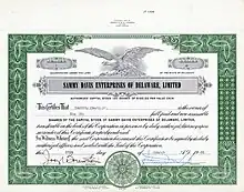 Acción de fundador nº 1 de Sammy Davis Enterprises of Delaware, Ltd. por 6 acciones de 100 $ cada una, emitida el 25 de marzo de 1965, registrada a nombre de Sammy Davis Jr. y con su firma manuscrita como Presidente. El capital social de su productora era de 10.000 dólares.