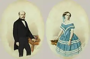 At left, a painting of a balding, mustachioed middle-aged man in black-tie formal attire standing beside a red table. At right, a painting of a woman in a blue dress with white stripes, standing beside a red table.