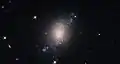 ESO 486-21 es una galaxia espiral con una estructura algo irregular y probremente definida.