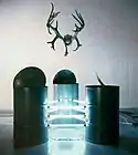 Vasiliy Ryabchenko, "Big Bembi", installation, barrels, linear lamps, deer horns, 1994