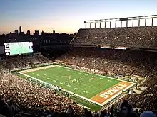 A football game and crowd in a stadium