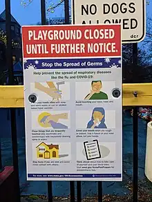 Sign on a gate of a playground, advising that the playground is closed until further notice due to the coronavirus pandemic, and instructing users to wash their hands, avoid touching their face, clean things that are frequently touched, cover their mouths when coughing and sneezing, stay home if they're sick, and think ahead about how to take care of themselves and their loved ones.