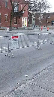 Metal barricades with signs