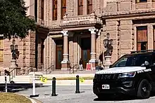 Barricade tape in front of the Texas Capitol