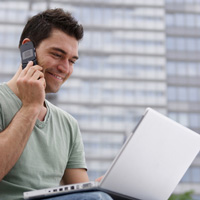 Man with laptop and mobile phone