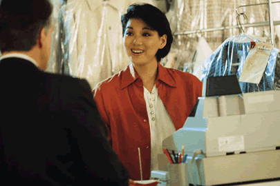 woman standing in front of cash register