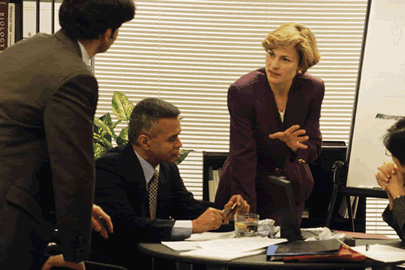 group of people working around a table