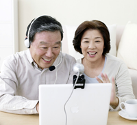 Couple using a webcam and headset
