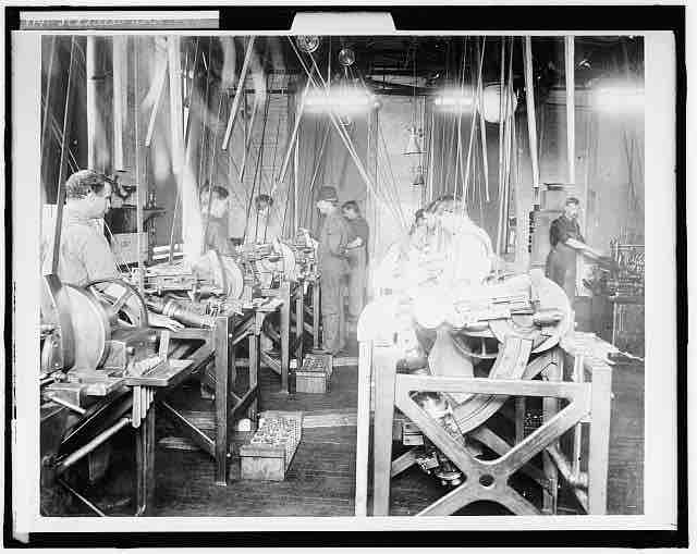 Factory Workers Assembling an Engine
