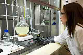 Chemist analyzing unknown sample