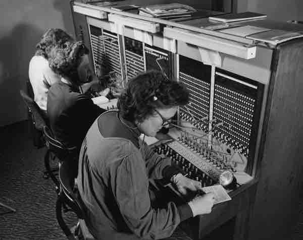 A switchboard staff making connections in 1979