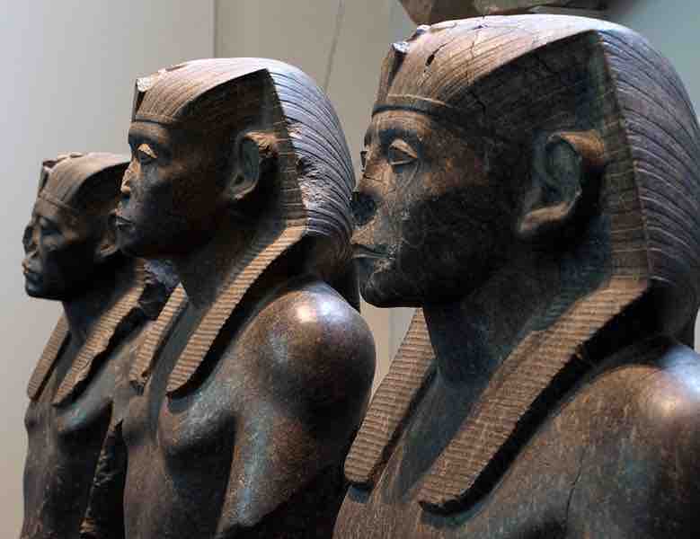 Three black granite statues of the pharaoh Sesotris III, seen in right profile (Twelfth Dynasty, circa 1850 BCE)