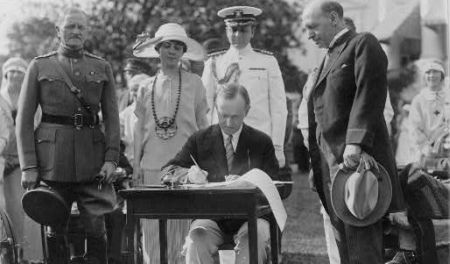 President Coolidge Signing a Bill into Law