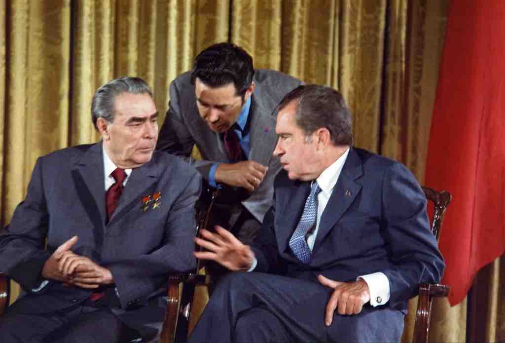 Soviet Premier Leonid Brezhnev and President Nixon (with a translator), 1973