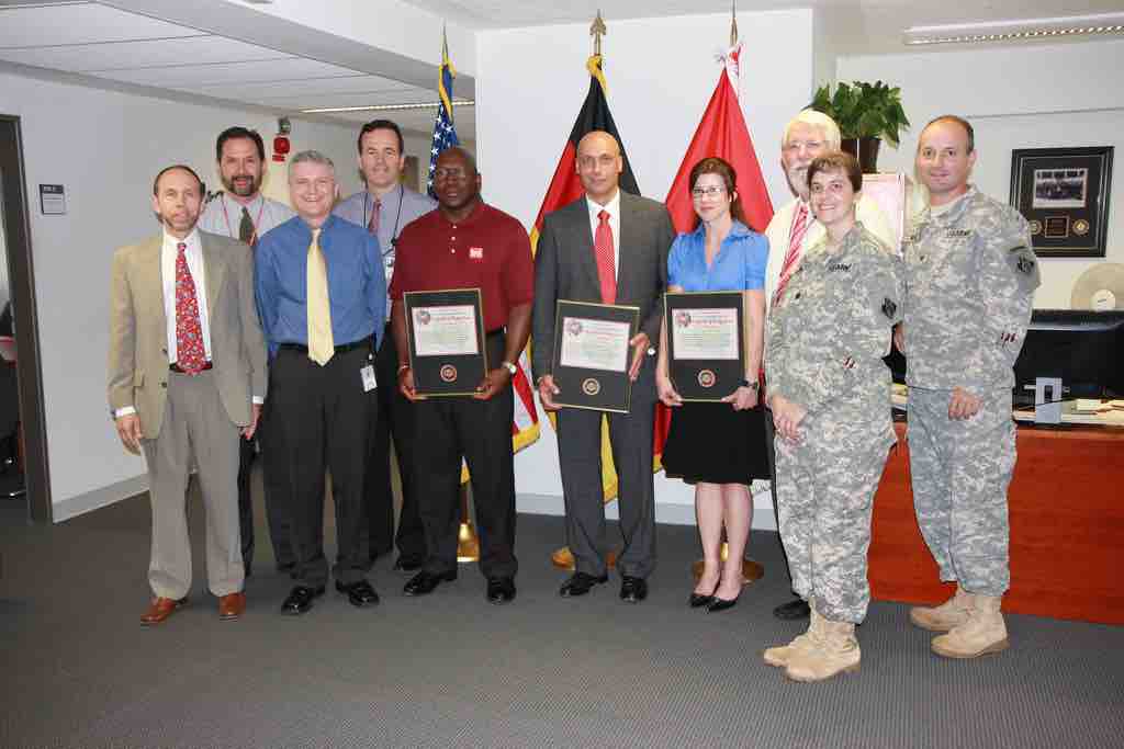 A group of leaders receiving recognition for their service.