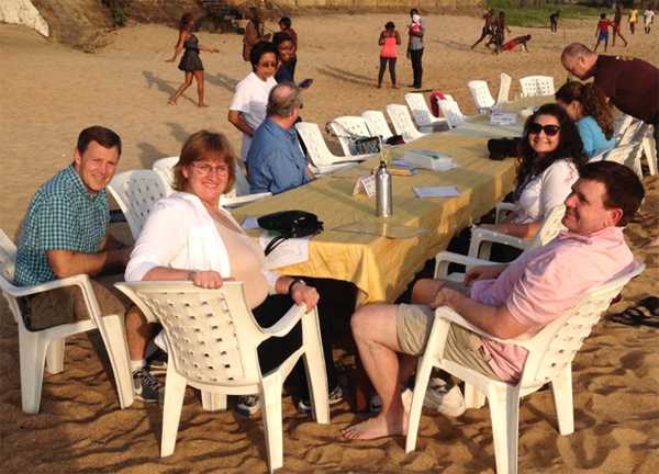 Gayle with fellow CDC employees, at a local restaurant, enjoying a farewell dinner for CDC staffers going back home.