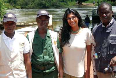 Rupa Narra (second from right), provides an infection control lesson to healthcare workers staffing a health inspection station at the border of Guinea.