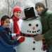 Family around a snowman