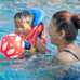 Mother and son enjoying swimming pool