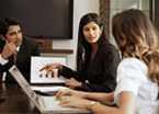 Teacher assisting students in classroom