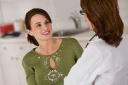 Photo of a woman speaking to her doctor