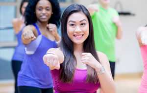 Photo of young women participating in an aerobics class