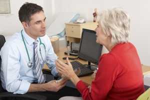 Photo of a woman talkting to her doctor