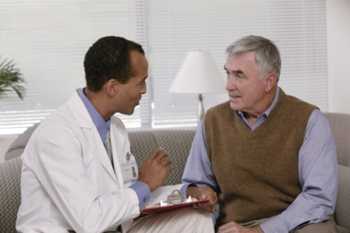 Photo of a man talking to his doctor